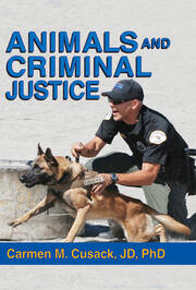police officer holds German Sheppard on the job