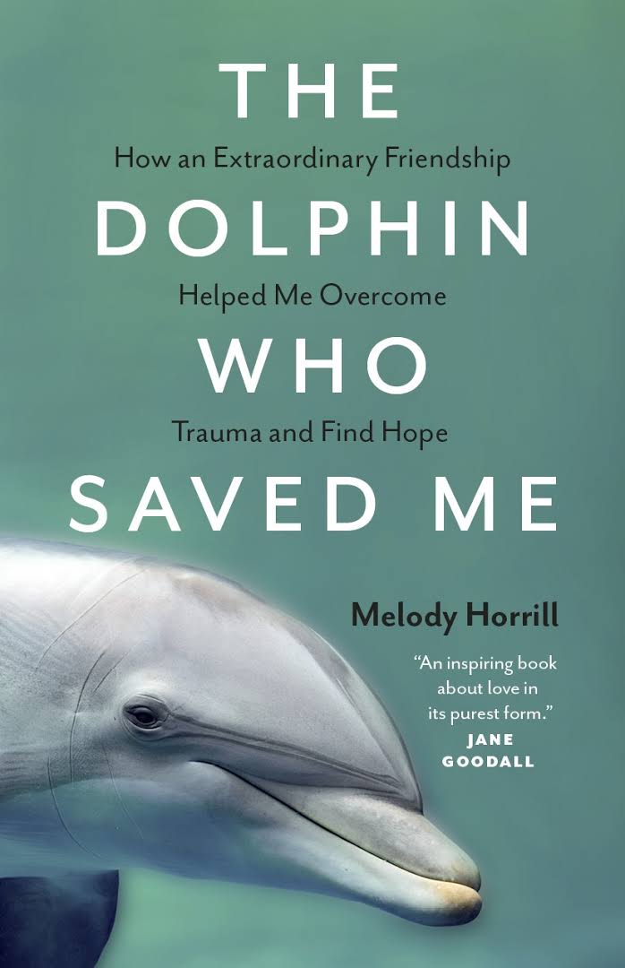 dolphin pokes head through left side of book cover