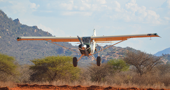 patrolling prop plane lands in the savannah in Kenyan national park
