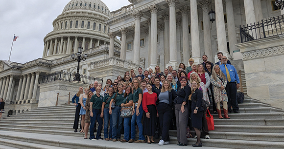HHC representatives stand together on the Capitol steps
