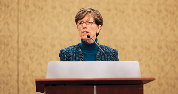 Nancy Blaney delivers a speech at a podium