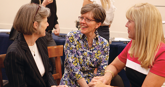 Nancy Blaney meets with two other women sitting down