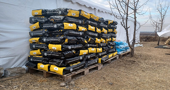 dog food bags stacked high on pallets