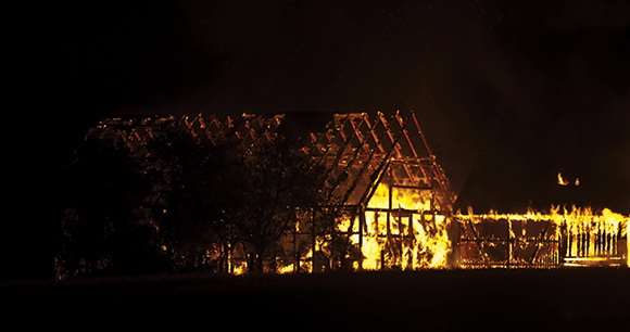 barn burns at night