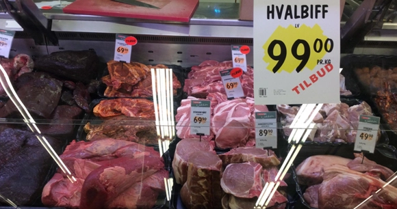 a meat counter with whale meat for sale