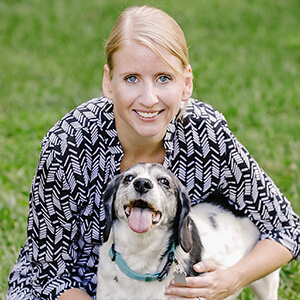 profile of Claire Coughlin with a dog