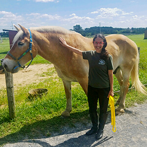 profile of Joanna Grossman with a horse
